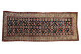 Antique Northwest Persian runner, navy field, allover blush-red floral design, 5'5