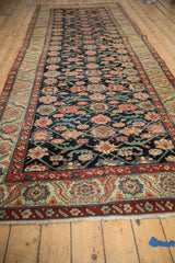 Antique Northwest Persian runner's field: navy blue, blush floral top views, geometric vines.