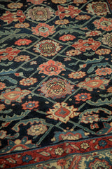 Antique Northwest Persian runner detail showing floral top views, geometric vines, navy, and madder red.