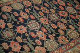 Antique Northwest Persian runner's navy field with floral motifs, geometric vines, subtle wear.
