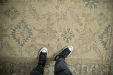 Close view of a distressed Oushak rug's even wear, showing low pile and visible knot heads.