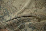 Even wear across the knot heads creates a soft, tactile texture on the distressed Oushak carpet.