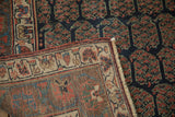 Close-up of the antique hand-knotted Kurdish runner's tightly woven foundation, light fringe, and intricate border details.