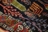 Nuanced plant fills on madder root red Bakhtiari border and dark navy garden motifs.