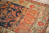 Contrasting floral and geometric design examples on a hand-knotted antique Malayer sampler rug.