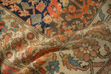 Varied sampler motifs and evenly worn, textured pile of an antique hand-knotted Malayer rug.