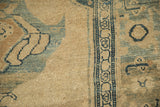 Evenly worn, low-pile texture and dusty blue turtle samovar border of an antique Kurdish rug.