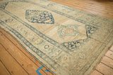Detail of the diamond medallion and uniquely drawn floral motifs on a distressed antique Kurdish runner.
