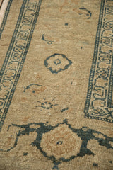 Close-up on the distressed, low pile and turtle samovar motifs of an antique Kurdish rug runner.