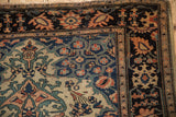 Corner detail of a Persian Farahan Sarouk showing the intricate palmette border and low pile.