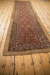 Antique Serab runner end, natural camel hair selvage, short fringe, and rich geometric border.