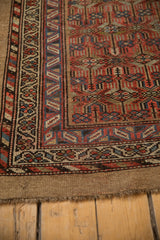 Antique Serab runner's finished end, revealing natural camel tones in the foundation and intricate border.