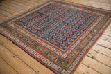 Collector's antique Northwest Persian rug, showing navy field with repeating botehs and deep green border.