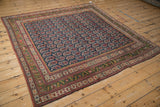 Antique Northwest Persian rug corner, navy field with repeating botehs and unusual deep green border.