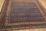 Antique Northwest Persian rug corner, with unusual deep green geometric border and navy botehs.
