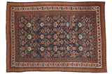 Antique Persian Mahal carpet with a colorful allover Herati design on a deep navy blue field.