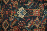 Even wear on the hand-knotted pile of an antique Mahal carpet's colorful Herati motif.