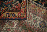 A folded corner of an antique Mahal carpet reveals the hand-knotted pile and woven foundation.