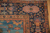 Antique Mahal rug corner, navy Herati design field, multi-tiered floral starburst border.