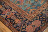 Antique Mahal carpet corner with multi-tiered border, starburst florals, and Herati motif.