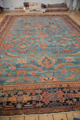 Antique Mahal carpet: detailed multi-tiered floral border with starburst motifs in navy, brick red.