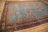 Hand knotted antique Persian Mahal rug, detail of multi-tiered navy floral border with blush starbursts.