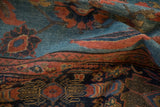 Antique Mahal carpet detail: abrash, multi-tiered floral border, blues and brick red.