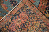 Antique Mahal rug corner with brick multi-tiered border, indigo pattern, and abrashed sky blue.