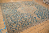 Distressed Hamadan rug's expertly restored side border and faded blue field.