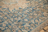 Distressed indigo blue and sand geometric patterns on an antique Hamadan rug.