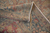 Abrashed distressed pile and intricate hand-knotted Tabriz carpet foundation.