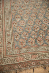 Distressed antique Bijar runner corner: boteh field, vine borders, fringe. Silver and sandalwood tones.