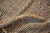 Folded antique distressed Bijar runner showcasing muted boteh field, abrash, and border patterns.