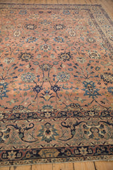 Detailed Safavid Kerman border with OCM cartouche, rich navy, dusty coral, and fine arabesques.