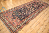 Antique Malayer rug corner detailing dusty blush and beige borders with a distinct Herati pattern.