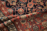 Antique Malayer Herati pattern detail: dark navy, dusty blush, beige, with mostly even wear.