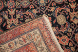 Antique Malayer rug detail, Herati pattern in navy, blush, beige, with folded selvage.