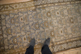 Vintage distressed Kurdish Hamadan runner's low Herati pile, olive, silver, and blue abrashes.