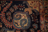 Vintage Mohajeran Sarouk carpet's plush pile, showcasing intricate floral vinery in navy, red, and gold.