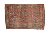 Distressed vintage Bijar rug with a red Herati motif and a dusty teal samovar turtle border.