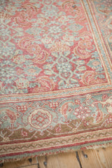 A close view of the ruby red and dusty teal samovar turtle motif on a vintage Bijar rug.