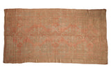 Hand-knotted vintage distressed Oushak rug in soft blush and silver with floral patterns, 6' x 11'2