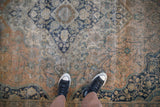 A view from above showing the low pile and storied wear to the foundation of an antique Kashan carpet.