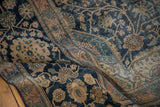 The storied, low-pile texture and floral details of a hand-knotted antique Mohtashem Kashan carpet.