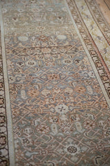 Distressed Malayer runner with geometric Herati and curvilinear blossom motifs in dusty blue, teal, olive.