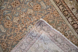 Distressed antique Malayer rug pile and woven foundation with muted Herati patterns.