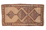 Antique Northwest Persian rug with triple diamond medallions in red and blue on a beige lattice field.