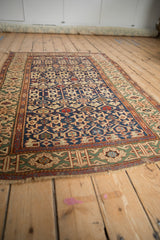 Antique Caucasian rug: navy, red, green geometric Koneghand design and Kufic border.