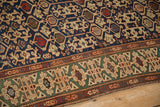 Geometric Kufic border in jade green and Koneghand allover pattern of antique Caucasian rug.