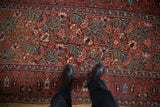 Antique Northwest Persian runner with cherry red floral bouquets and paisley boteh border.